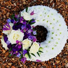 Based Wreath with a White and Purple Spray