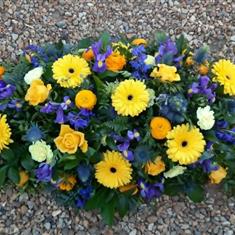 Yellow and Blue Casket Spray